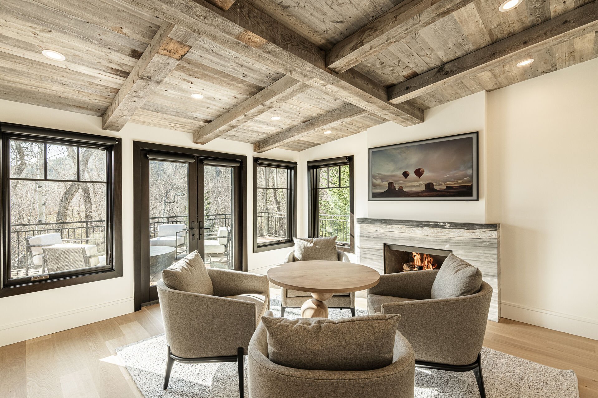Sun Peak Manor House - Sitting room with gas fireplace, smart TV and deck access
