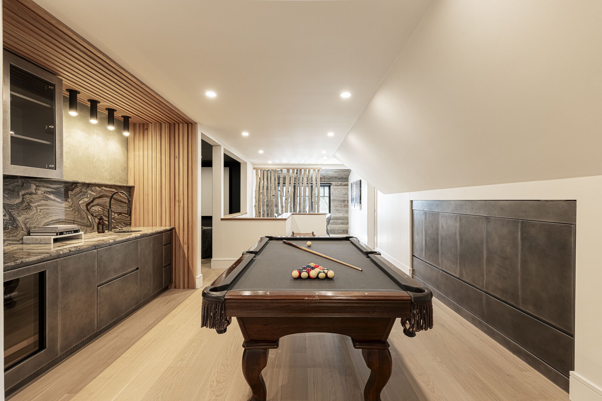 Sun Peak Manor House - Upper level game room with a wet bar with mini fridge and pool table