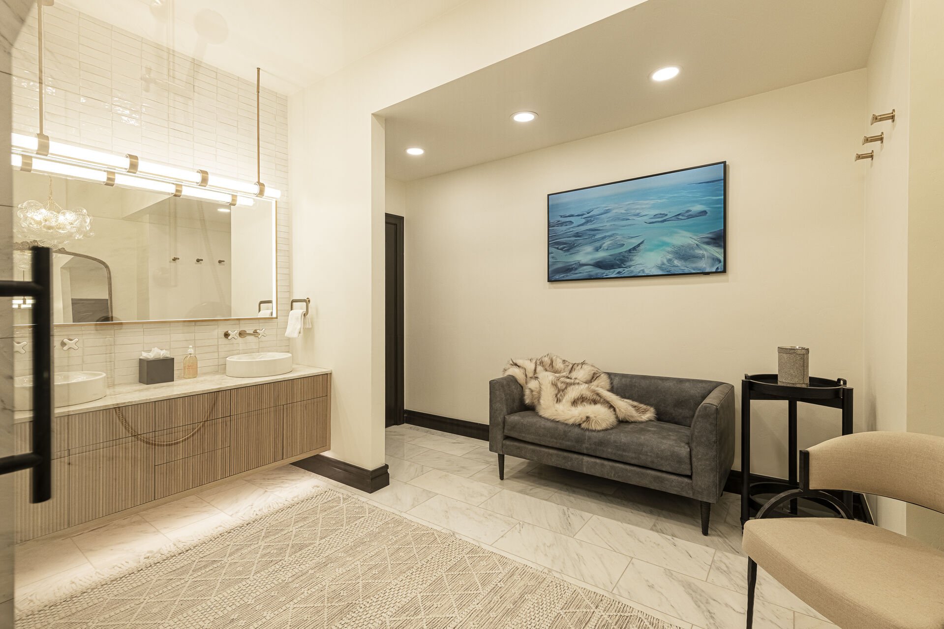 Peak 5 Cabin - Lower Level Bathroom Bridal Suite sitting area and a vanity with two sinks